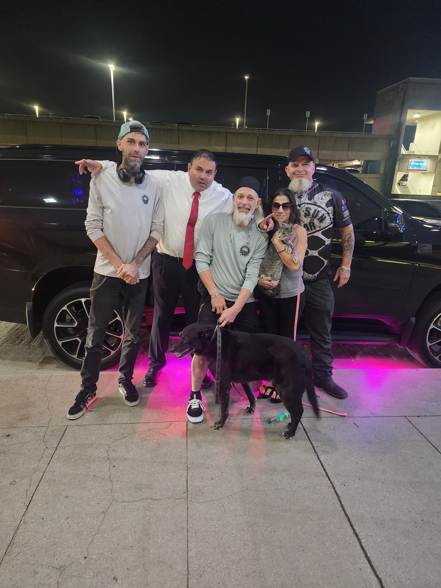 Group photo at airport with dog